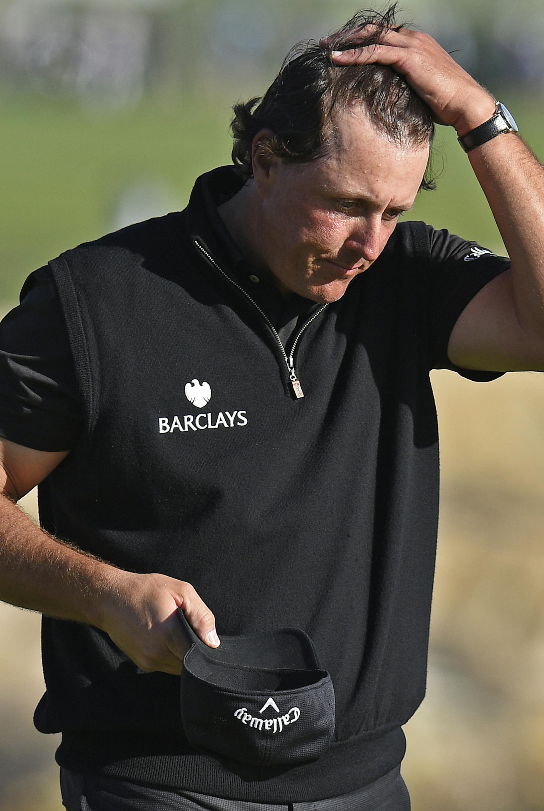 Phil Mickelson reacts after missing a birdie putt to force a playoff on the 18th hole during the final round of the AT&T Pebble Beach Pro-Am golf tournament in Pebble Beach, Calif., on Sunday, Feb. 14, 2016. Vaughn Taylor finished with 17 under par to win the tournament by one stroke. Mickelson came in second and Jonas Blixt finished third. (Jose Carlos Fajardo/Bay Area News Group/TNS)