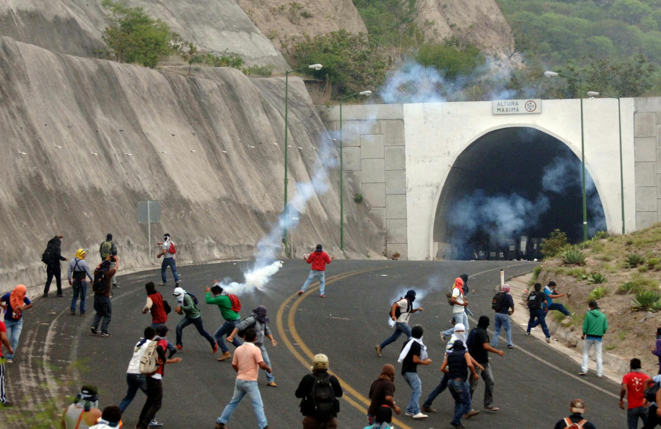 Police in riot gear confronted students as they protested official corruption near Tixtla, Mexico.