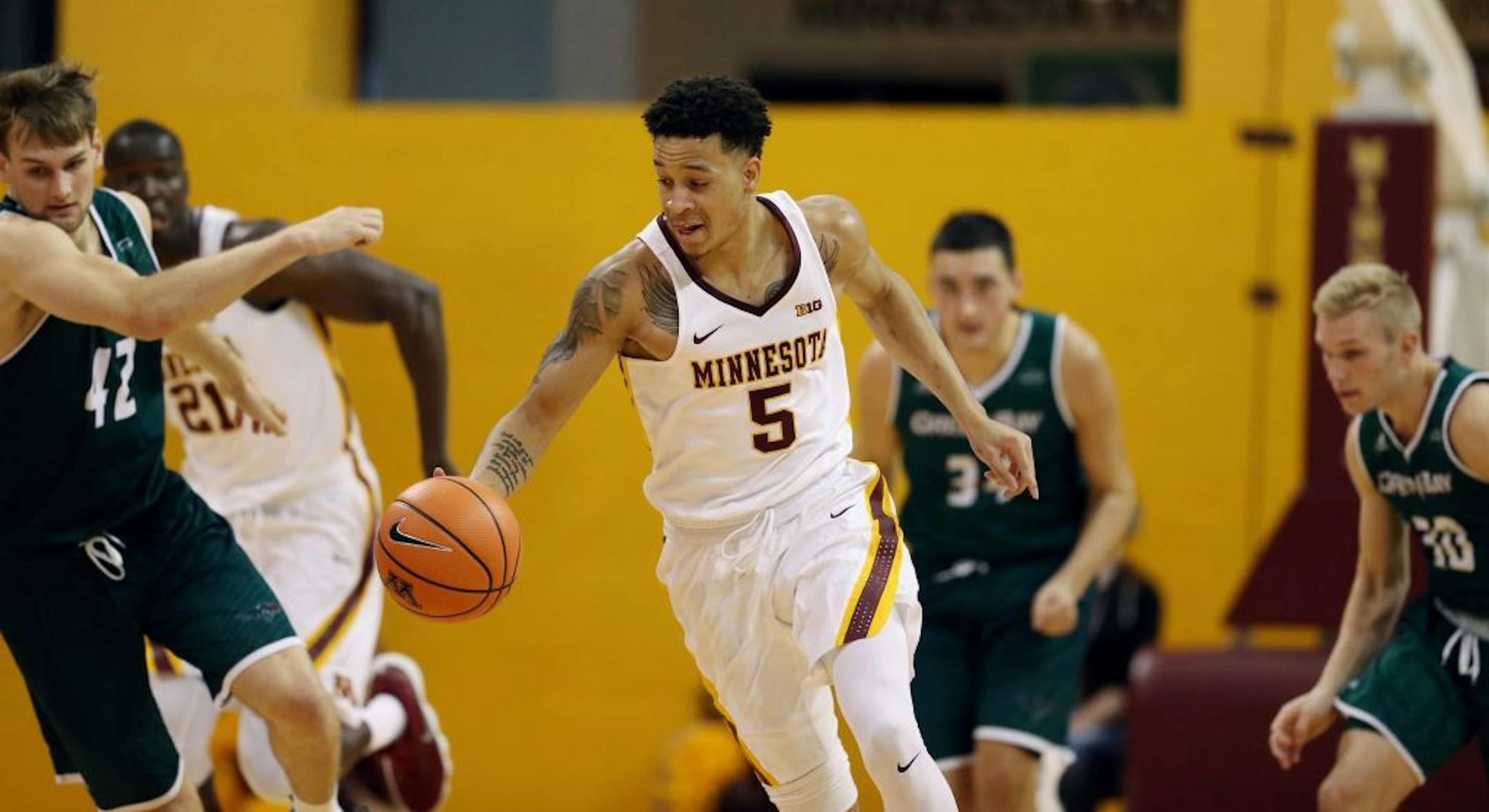 Gophers guard Amir Coffey drove down the court during an exhibition game vs. UW-Green Bay for hurricane relief for Puerto Rico at Maturi Pavilion on Sunday. Minnesota beat UW -Green Bay 115-86.