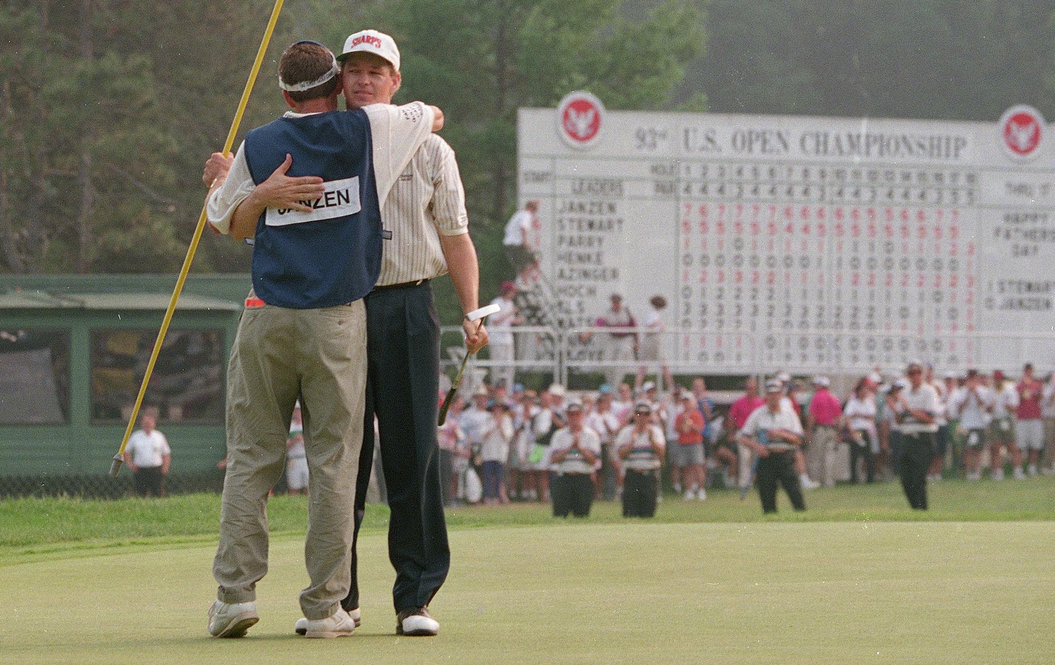 Lee Janzen hugs his caddy, Dan Huber, after winning the U.S. Open Golf Tournament at Baltusrol Golf Club in Springfield, N.J. on June 20, 1993. (AP Photo/Wilfredo Lee) ORG XMIT: APHS148