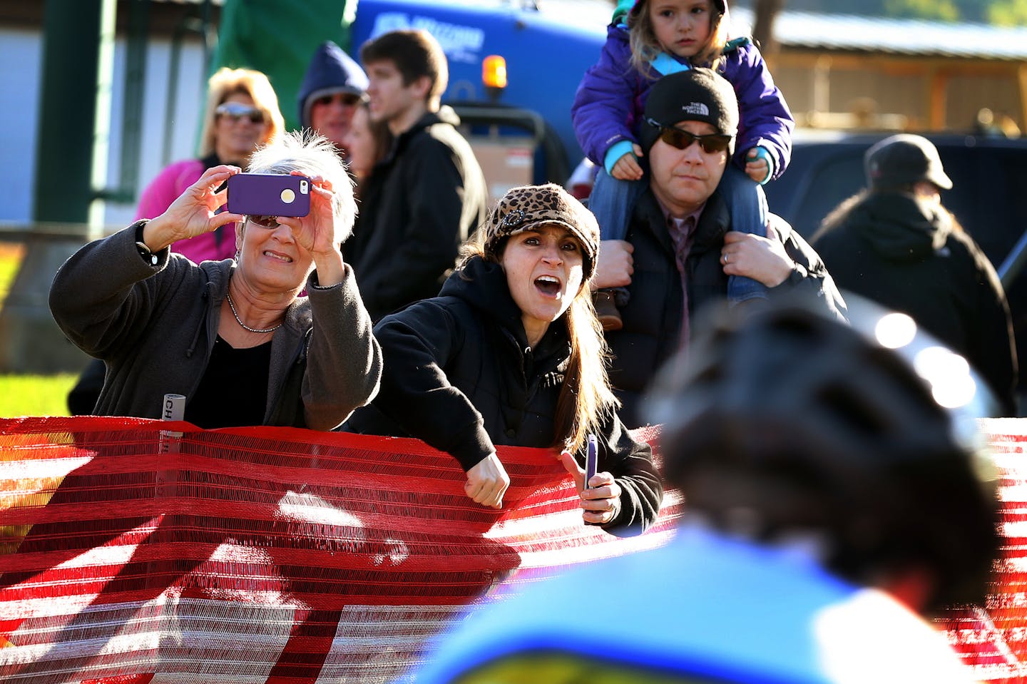 Dawn Peterson of Rosemount, Minn. cheers for her son during a Minnesota High School Cycling League race at the Mount Kato ski area in Mankato, Minn. ] LEILA NAVIDI leila.navidi@startribune.com / BACKGROUND INFORMATION: Sunday, October 12, 2014. Two years since its first event, the Minnesota High School Cycling League has grown from 16 teams to 34, with hundreds of high school riders meeting up for weekend races around the state this fall. New this year is teams from middle schools.