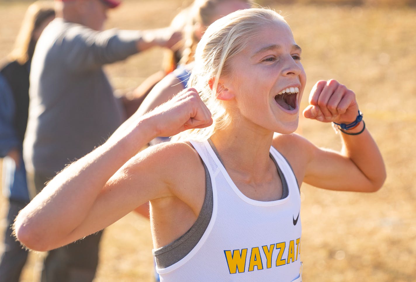 Wayzata's Abbey Nechanicky cheers on her teammates immediately after finishing first in the MSHSL Section 6AAA Girl's Cross Country Championships Wednesday, Oct. 26, 2022 at Gale Woods Farm in Minnetrista, Minn. Nechanicky set a personal record and course record of 16:43.70. ]