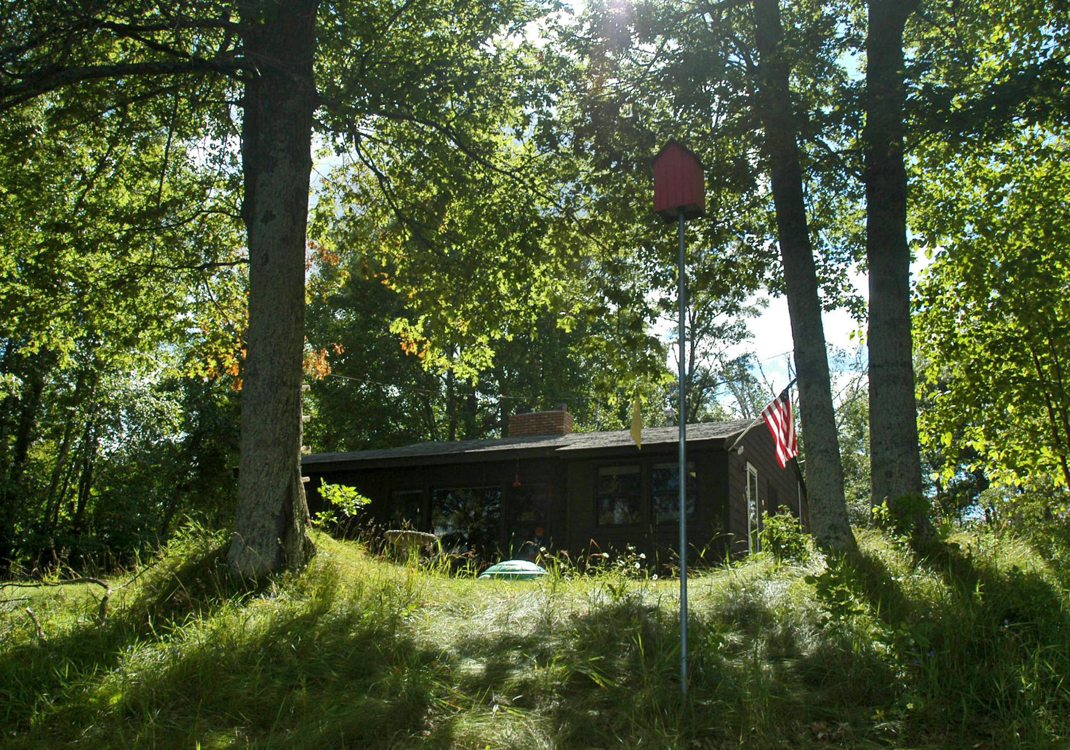 The Page cabin is a modest structure, built in the 50's by Diane's parents. Today, they cherish the cabin and it's quaint 1950's style interior such as the formica countertops, the linoleum tile floor and knotty-pine paneling.