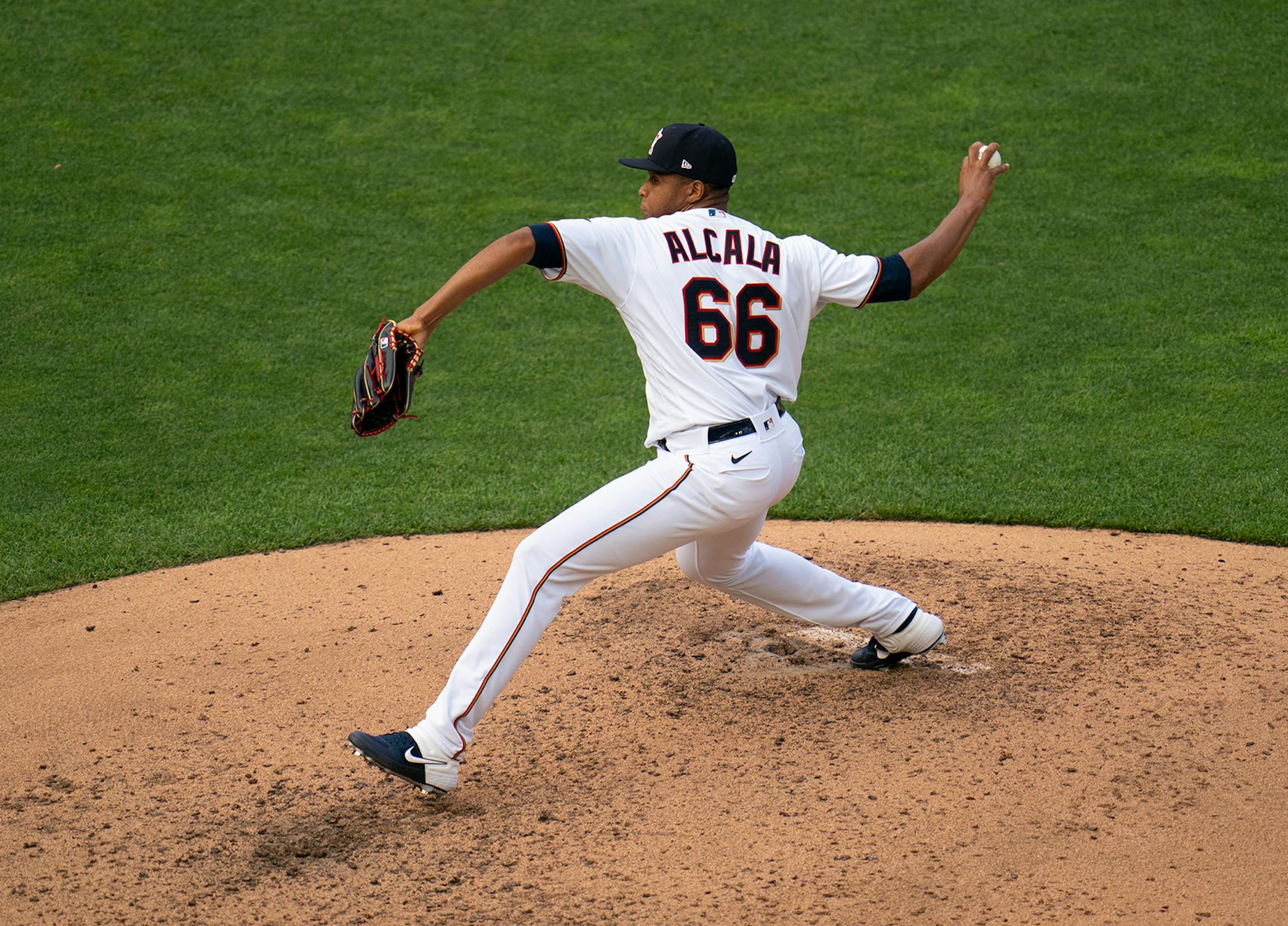 Twins relief pitcher Jorge Alacala (66) threw during live batting practice Monday evening.