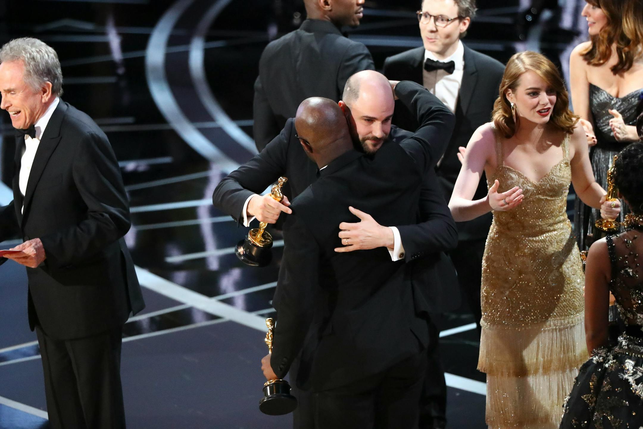 Confused Hollywood types on stage at the 2017 Oscars.