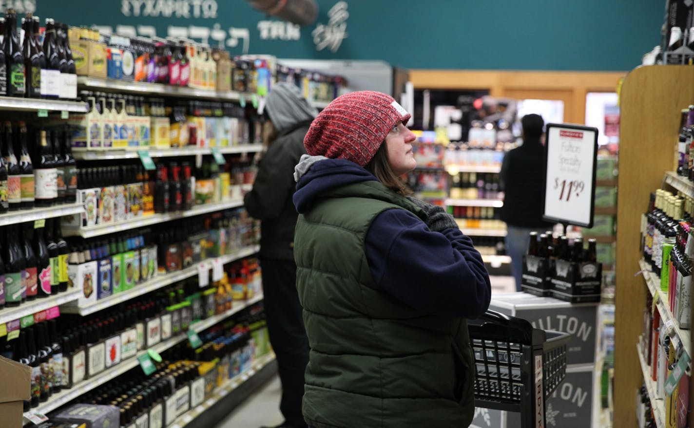 Susie Gindorff, 33, comes to shop in the Surdyk's liquor store on Sunday, March 12, 2017. She said she heard about the sales from a Facebook post.