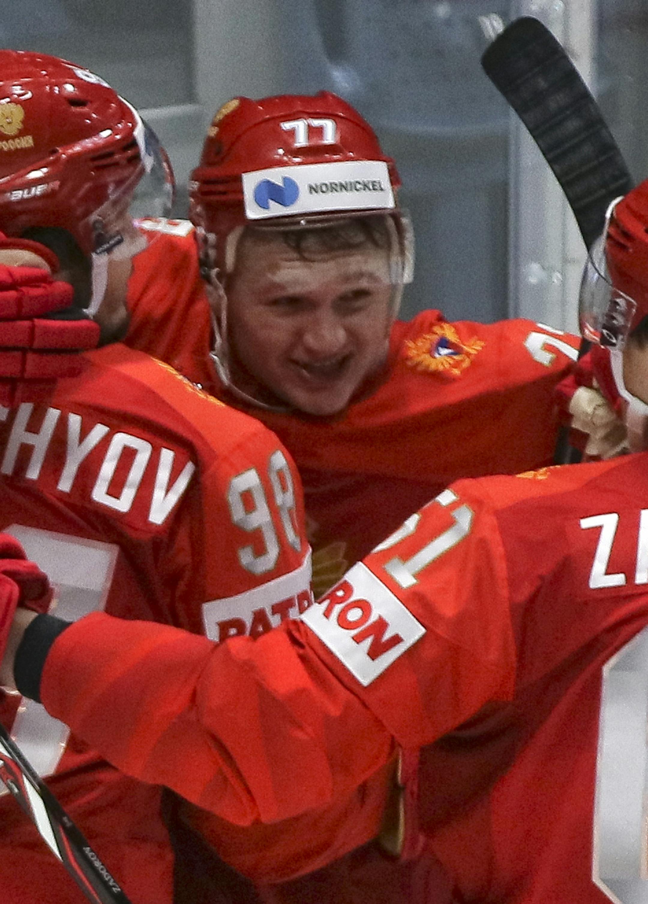 Russia's Kirill Kaprizov, center, celebrates scoring his side's third goal during the Ice Hockey World Championships quarterfinal match between Russia and the United States at the Steel Arena in Bratislava, Slovakia, Thursday, May 23, 2019. (AP Photo/Ronald Zak)
