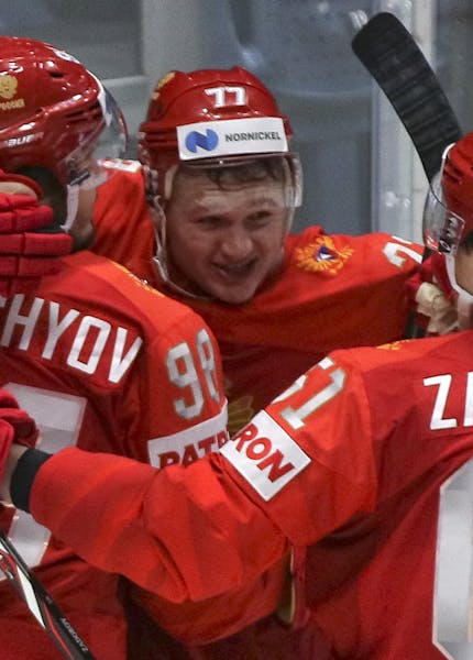 Russia's Kirill Kaprizov, center, celebrates scoring his side's third goal during the Ice Hockey World Championships quarterfinal match between Russia