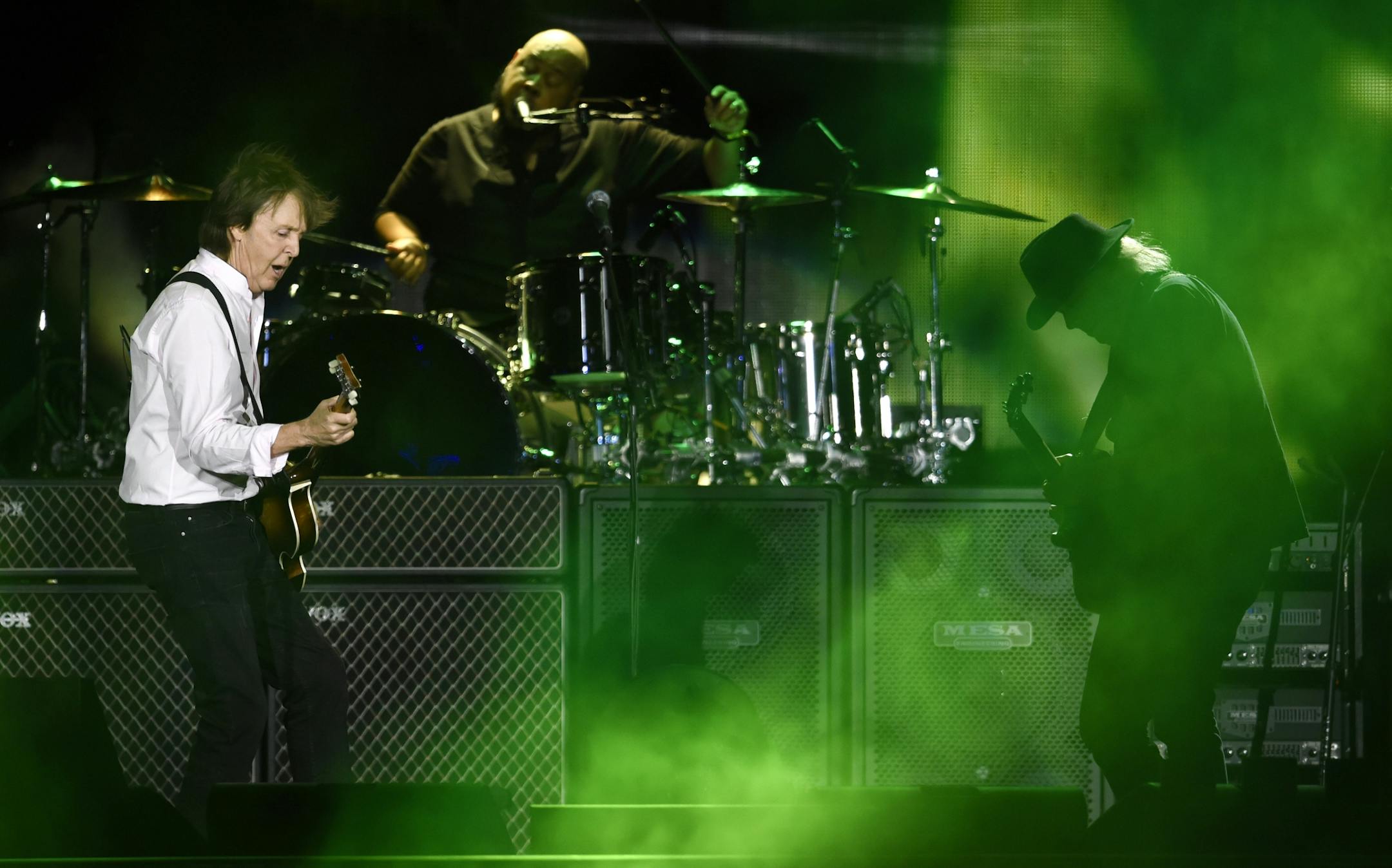 Paul McCartney, left, is joined by Neil Young during his performance on day 2 of the 2016 Desert Trip music festival at Empire Polo Field on Saturday, Oct. 8, 2016, in Indio, Calif.
