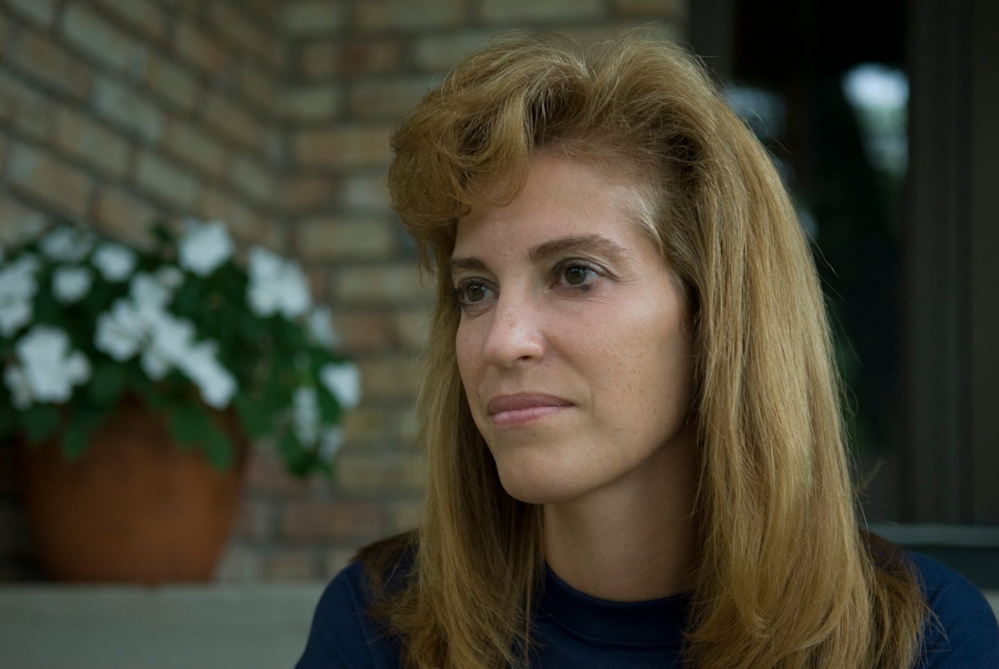 Musician Janelle Kendall outside her home in St. Cloud.