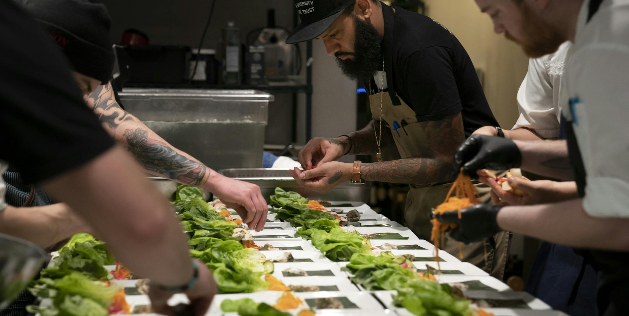 Chef and Top Chef contestant Justin Sutherland assembled a salad in the kitchen for a six course meal at the Handsome Hog in St. Paul, Minn., on Thursday, January 17, 2019. ] RENEE JONES SCHNEIDER ¥ renee.jones@startribune.com The restaurant hosted a six course meal before a viewing party of Top Chef, a show that Sutherland is a contestant on.