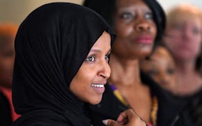 Rep. Ilhan Omar listened as a reporter asked about discussing other topics given her limited press availability during a press conference on the impac