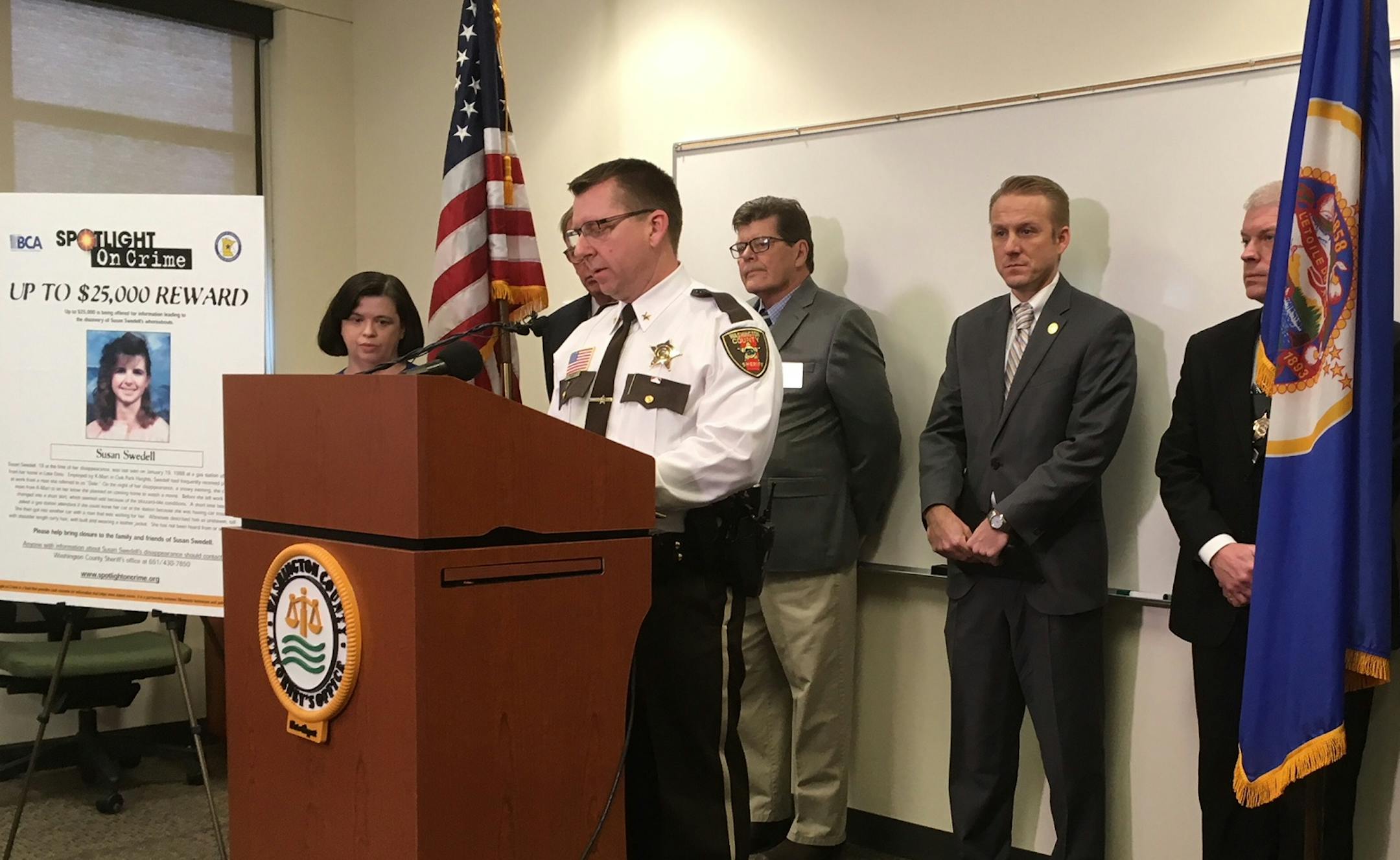 Washington County Sheriff Dan Starry speaks at a news conference Friday to announce the formation of a cold case unit to investigate the disappearance of Susan Swedell. On his right, near a photo of her sister, is Christine Swedell.