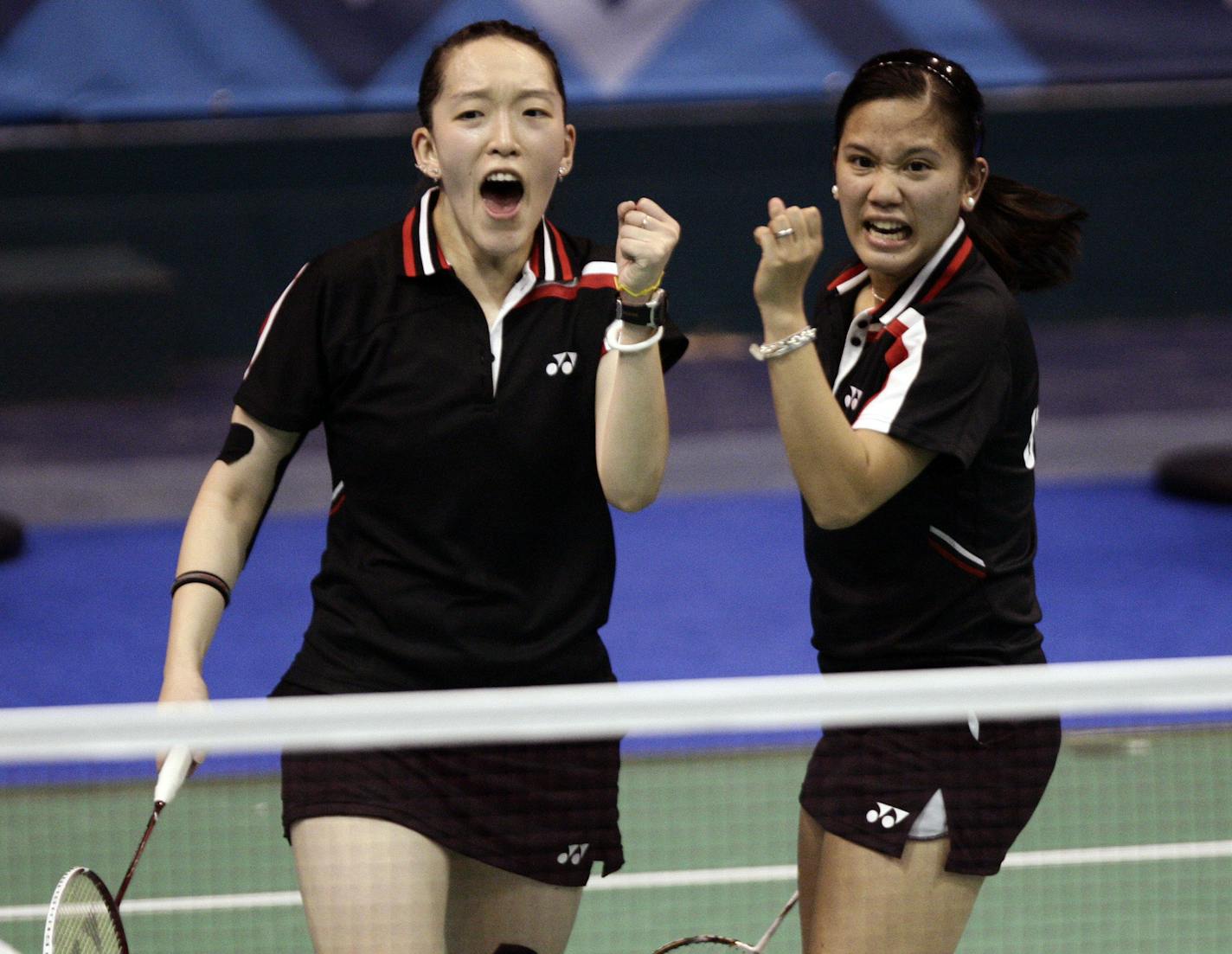 Eva Lee, left, and Paula Obanana, both from the United States, celebrate during a badminton women's doubles semifinal match against Alex Bruce and Michelle Li, both from Canada, at the Pan American Games in Guadalajara, Mexico, Tuesday, Oct. 18, 2011. Canada won 2-1. (AP Photo/Arnulfo Franco) ORG XMIT: XAF117