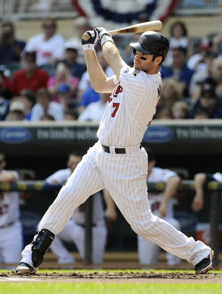 The Twins' Joe Mauer went 3-for-4 in Sunday's loss to the Tigers, raising his average to .323, while the league leader, Detroit's Miguel Cabrera, went