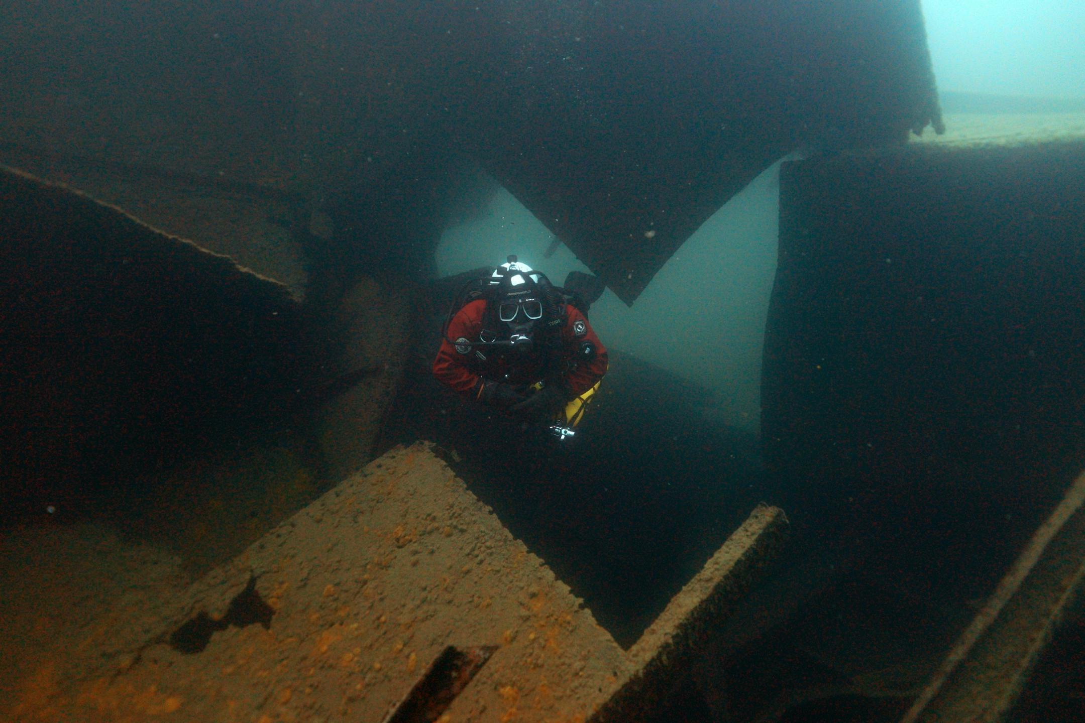 Jim Christenson a diver with the Great Lakes Shipwreck Preservation Society from Columbia Heights, emerged from the swim-through on the Madeira, a schooner barge that sank in Lake Superior on November 28, 1905, during a project dive.