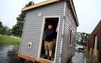 Brian Hurd has been homeless and living in a van for the past five years. Here, Hurd posed inside a tiny house under construction at Kandiyohi County 