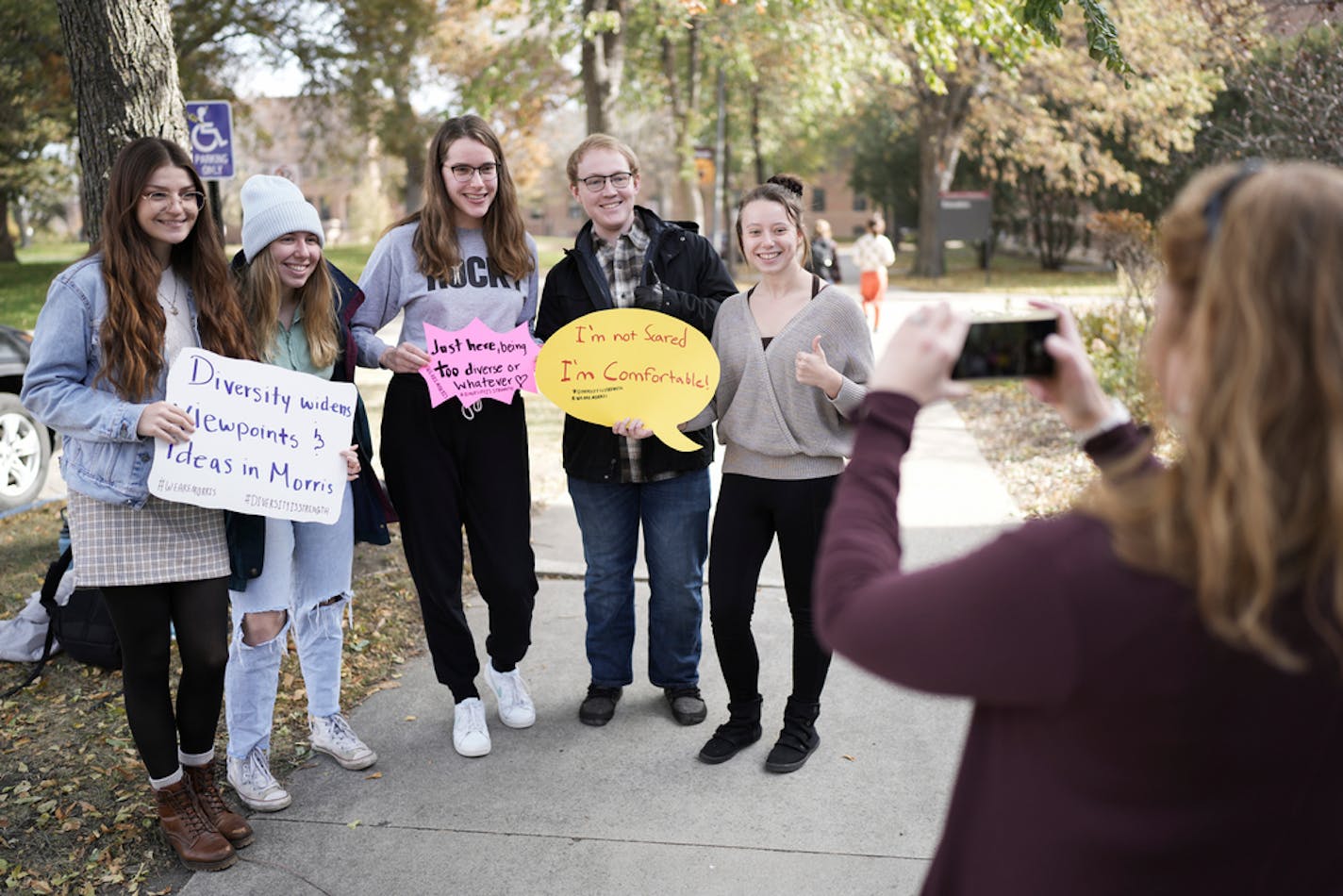 Students chanted, held signs and posed for pictures in support campus diversity Thursday, Oct. 20, 2022 in Morris. The rally was a response to University of Minnesota regent Steve Sviggum positing that growing shares of Native American, Black and other students of color could be related to overall enrollment declines on the small campus. ] MARK VANCLEAVE • mark.vancleave@startribune.com ORG XMIT: DSC07227_edt