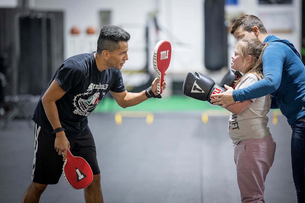 With the guidance of her mother, 8-year-old Ellie Aleckson learned to box with coach Jorge Mendoza.