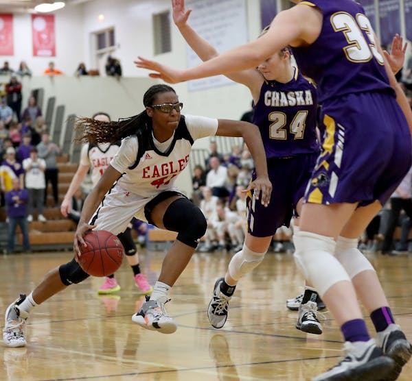 Eden Prairie's Nia Holloway (41) drives to the basket against Chaska's Mallory Heyer (24) during the second half of Eden Prairie's win in the Class 4A