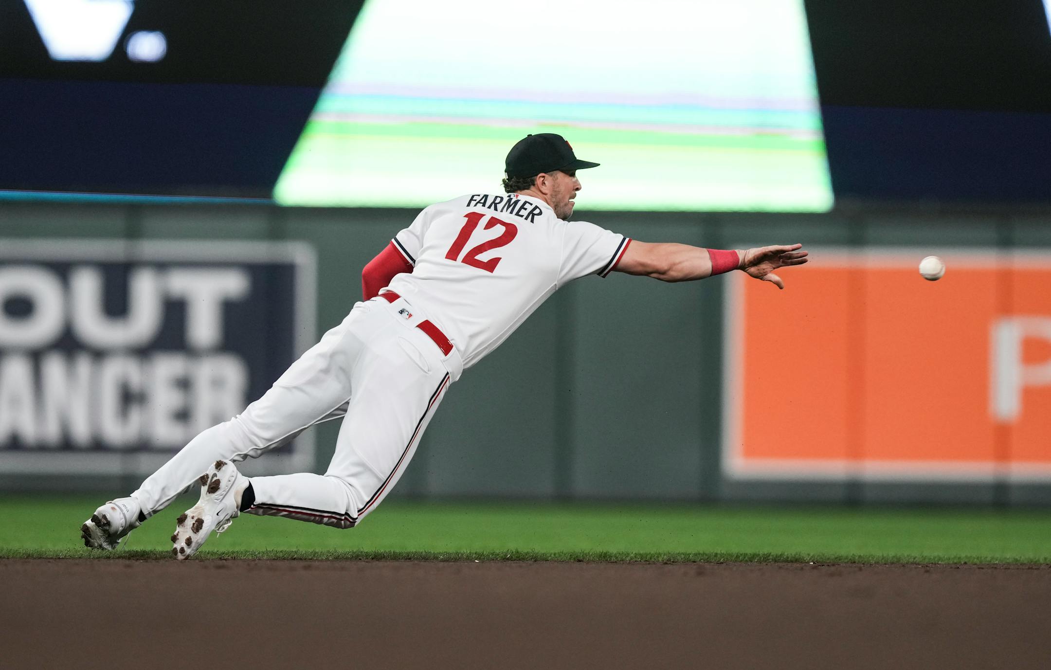 Minnesota Twins short stop Kyle Farmer (12) throws a grounder to second base for an out in the first inning. The Minnesota Twins hosted the Los Angeles Angels at Target Field on Friday, Sept. 22, 2023 in Minneapolis, Minn. ] RENEE JONES SCHNEIDER • renee.jones@startribune.com