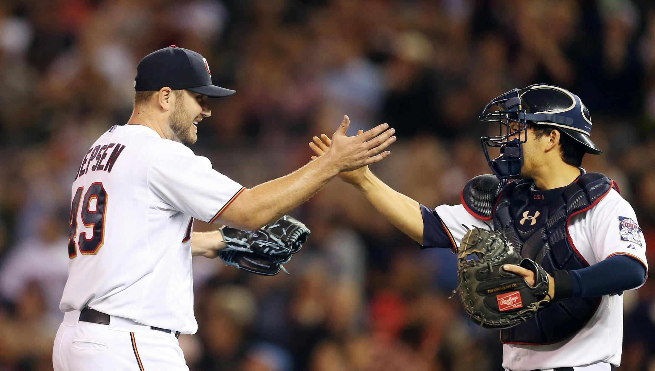 Minnesota Twins relief pitcher Kevin Jepsen (49) celebrated a win with s catcher Kurt Suzuki (8) at Target Field Tuesday September 22, 2015 in Minneapolis, MN.