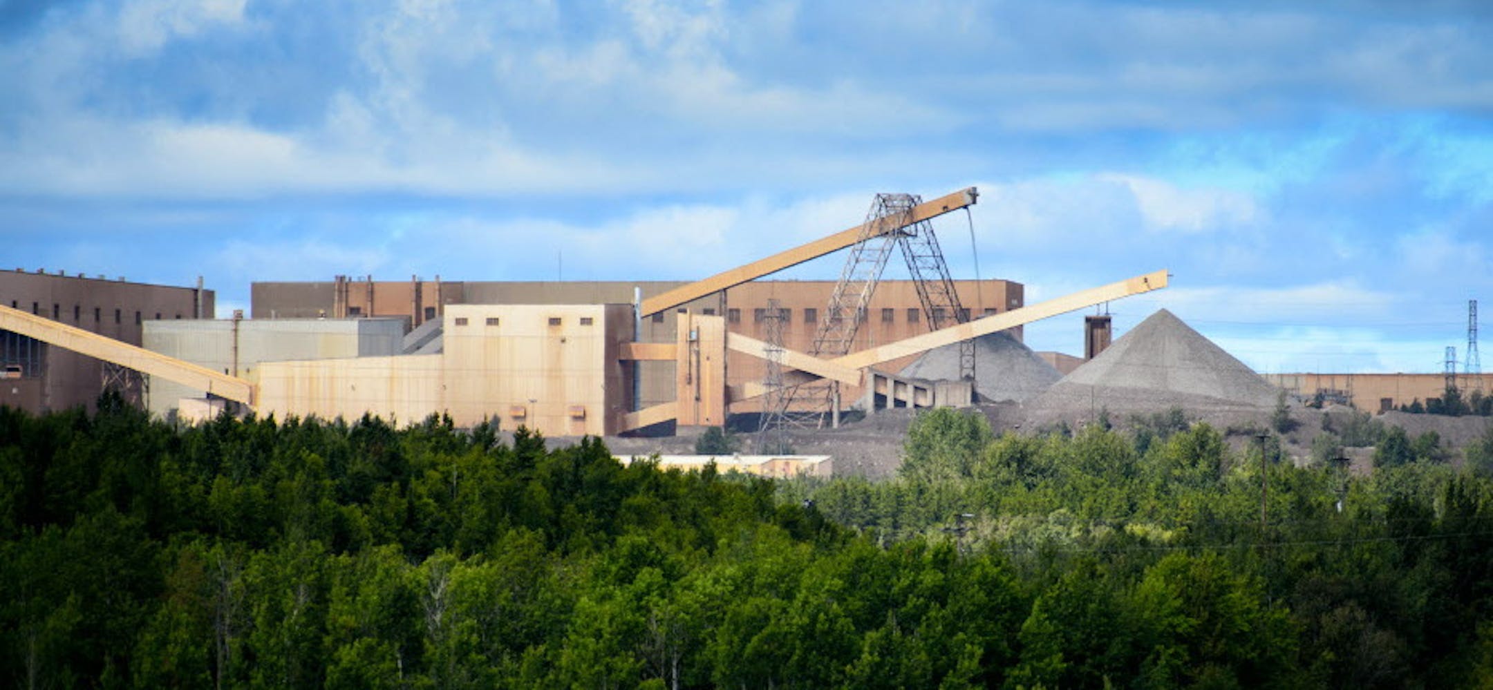 This photo taken Aug. 26, 2014, shows the Minntac taconite mine plant in Mountain Iron, Minn. U.S. Steel plans to idle part of its Minntac plant in Mountain Iron, resulting in layoffs for about 680 workers. (AP Photo/Star Tribune, Glen Stubbe) MANDATORY CREDIT; ST. PAUL PIONEER PRESS OUT; MAGS OUT; TWIN CITIES LOCAL TELEVISION OUT