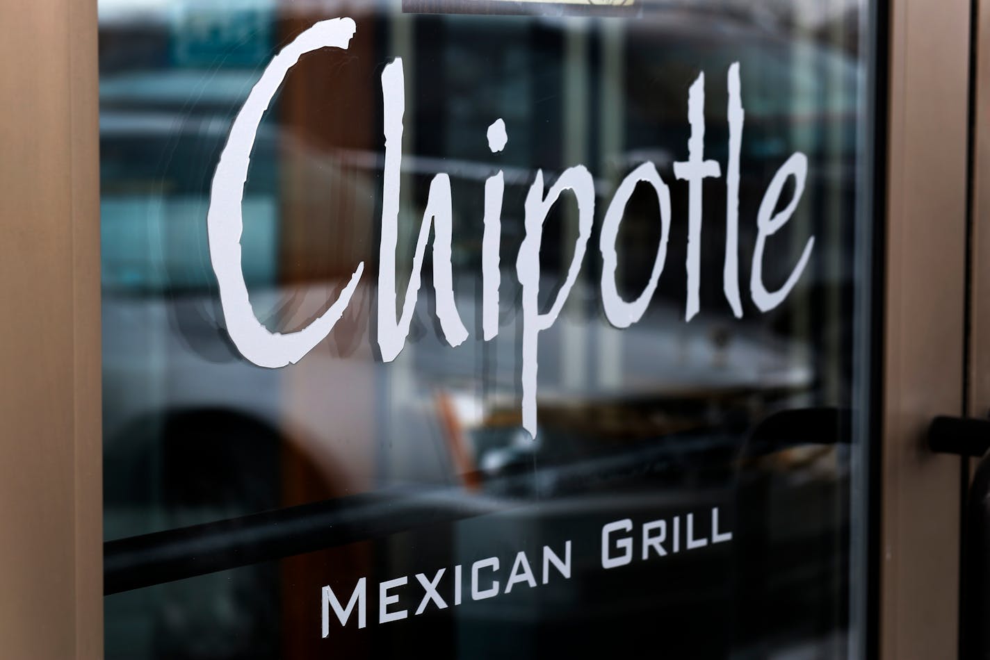 The door of a Chipotle Mexican Grill in Robinson Township, Pa.