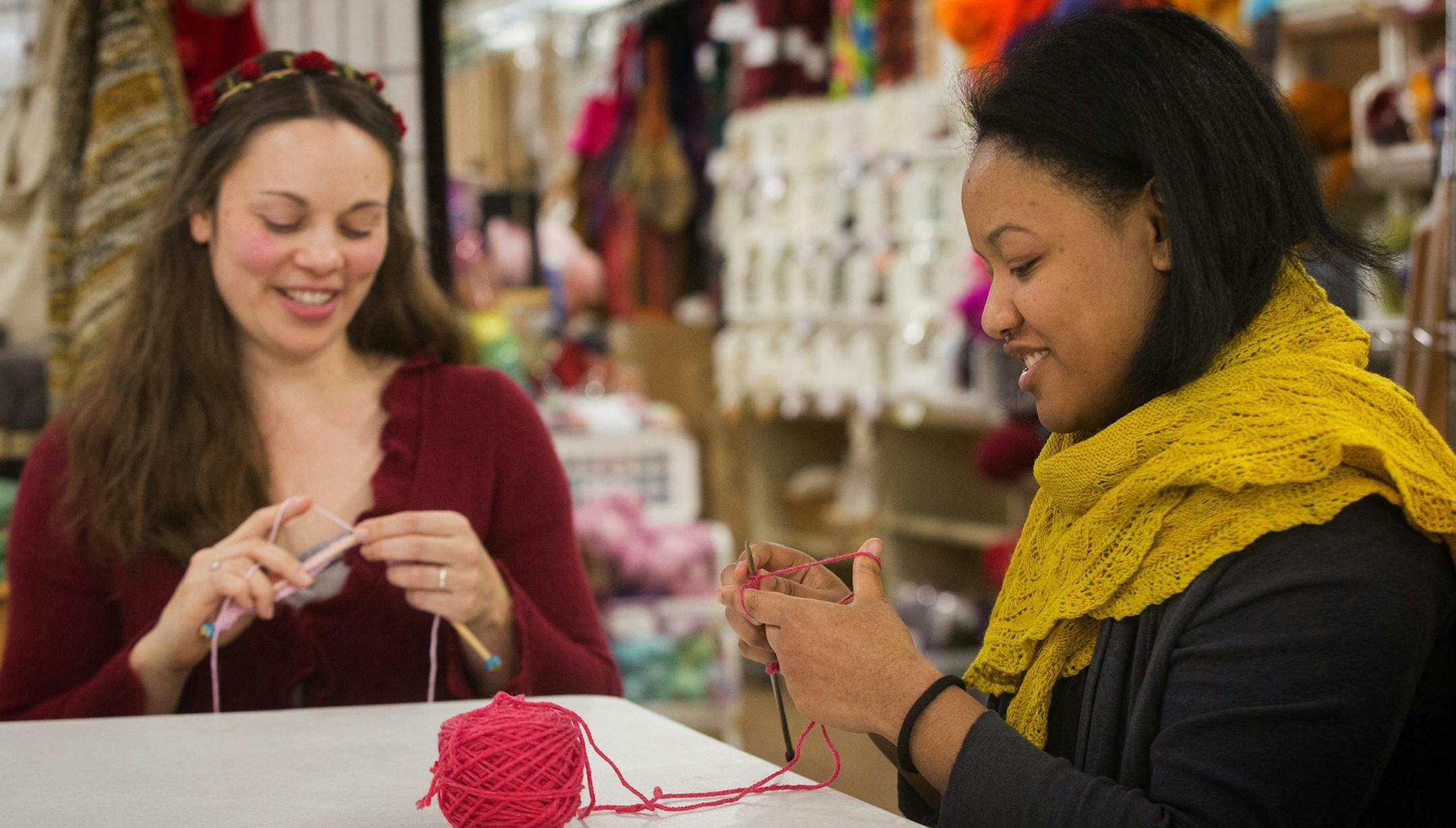 Jennifer Miller, left, a yarn wrangler, and Jessica Owens, manager of Weaving Works in Seattle, Wash. get started on knitting Pussyhats for women to wear at the Women's March on Washington. (Ellen M. Banner/Seattle Times/TNS) ORG XMIT: 1195454 ORG XMIT: MIN1701060010480674