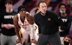 Gophers coach Richard Pitino and guard Marcus Carr (5).