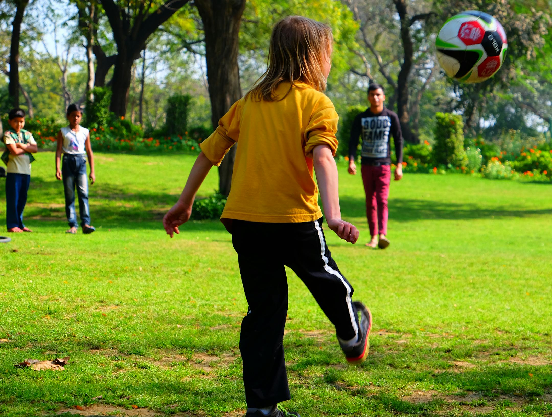 Theron Wangerin played with a new soccer ball and soon a group of kids joined in at a park in Mehrauli, once a village that is now part of Delhi.