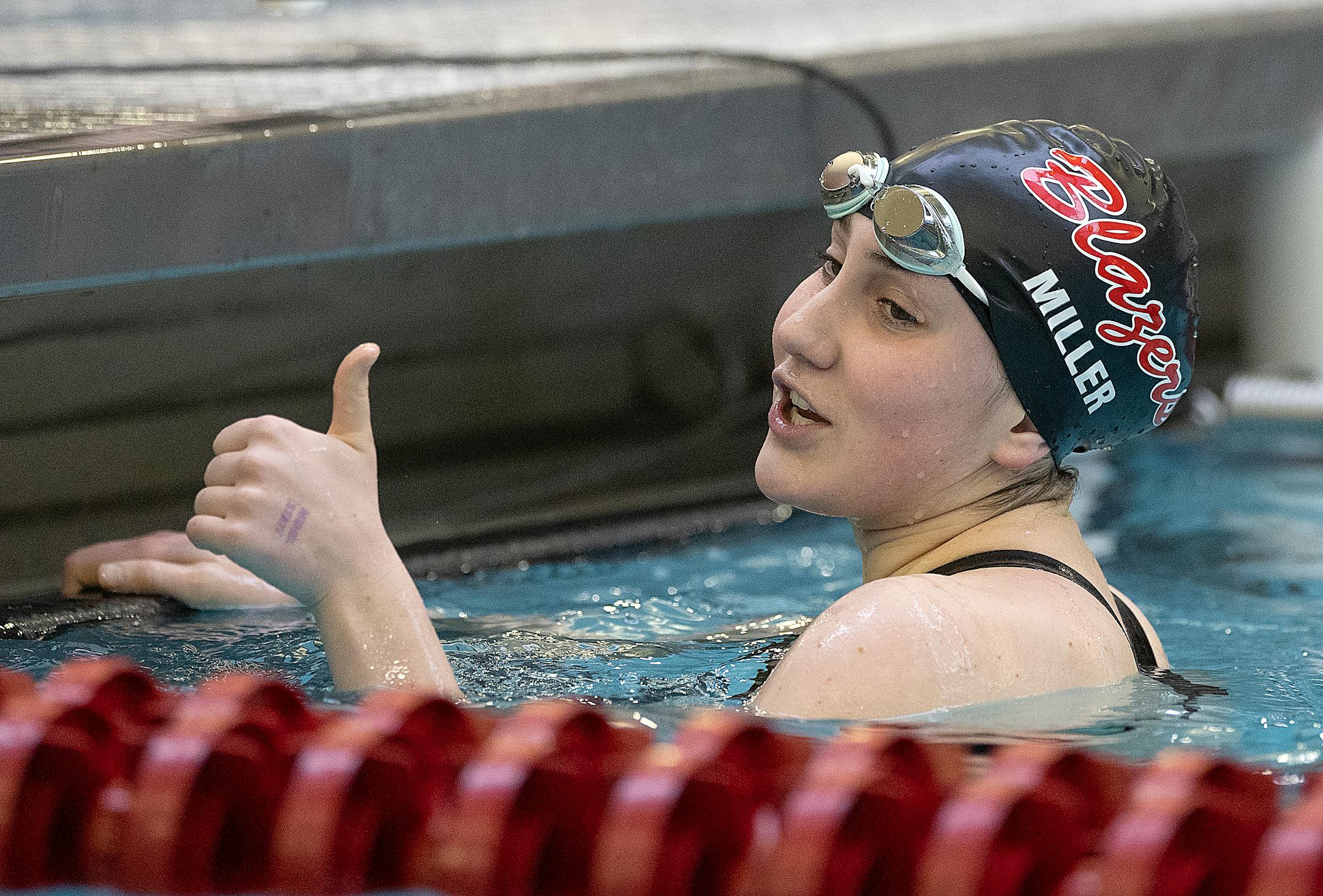 Visitation's Katie Miller gives a thumbs up to her opponent after she competed in the Girls 200 yard freestyle during the Class 1A preliminaries of the girls swimming state meet at the Jane K Freeman Aquatic Center in Minneapolis, Minn., on Friday, Nov. 17, 2023. ] Elizabeth Flores • liz.flores@startribune.com