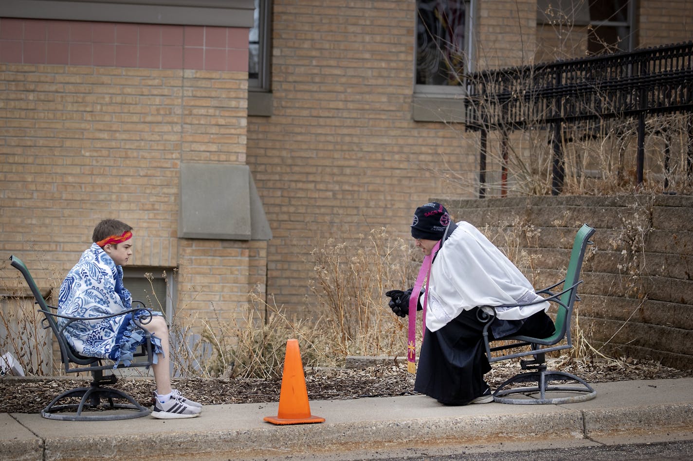 The Rev. Erik Lundgren listened to confessions outside Sts. Joachim & Anne Catholic Church in Shakopee on Wednesday, an adaptation made to cope with COVID-19.