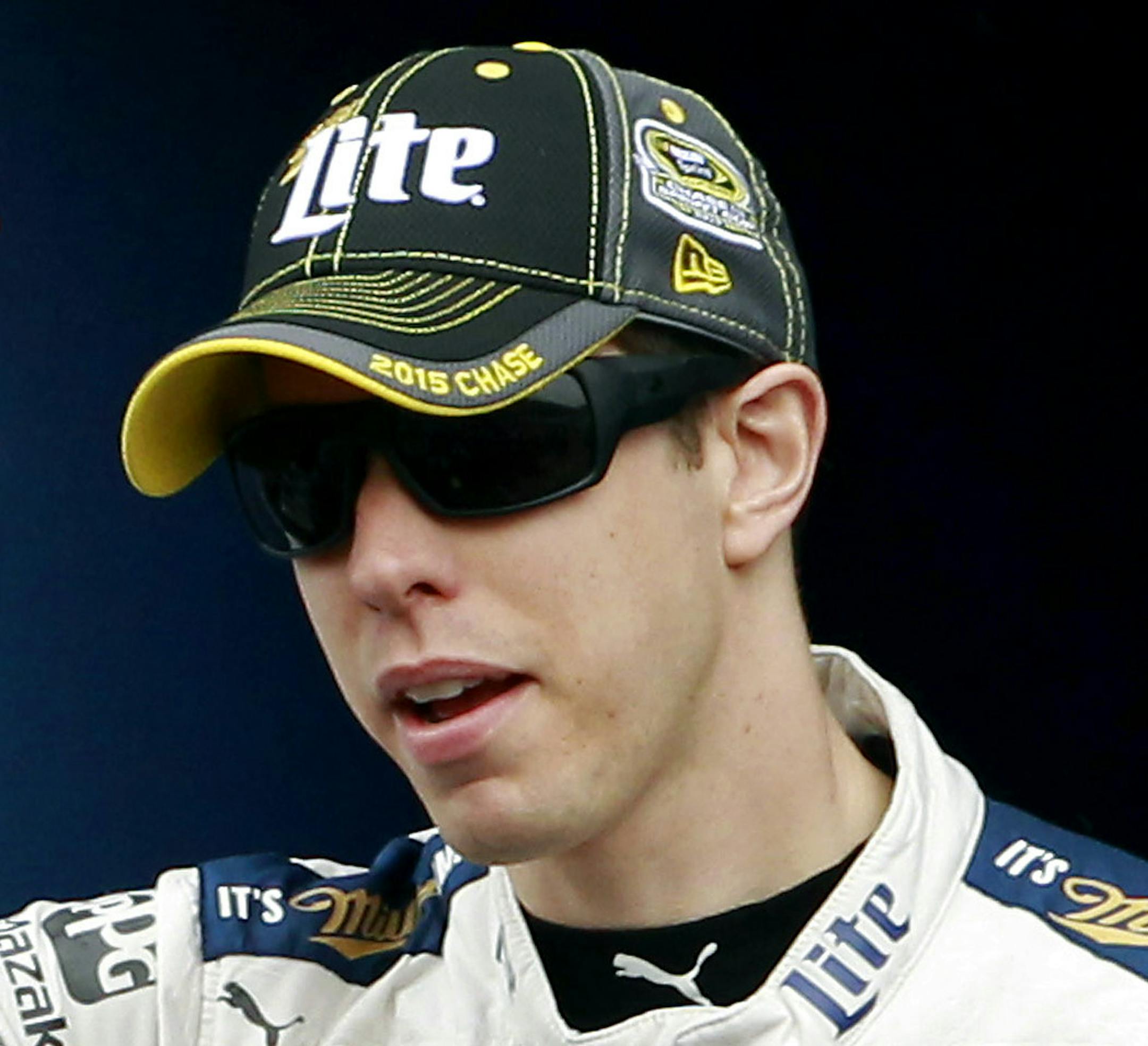 Brad Keselowski waves to the crowd during driver introductions before the NASCAR Sprint Cup Series auto race at Phoenix International Raceway, Sunday, Nov. 15, 2015, in Avondale, Ariz. (AP Photo/Ralph Freso) ORG XMIT: AZRF203