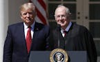 FILE - In this April 10, 2017, file photo, President Donald Trump, left, and Supreme Court Justice Anthony Kennedy participate in a public swearing-in