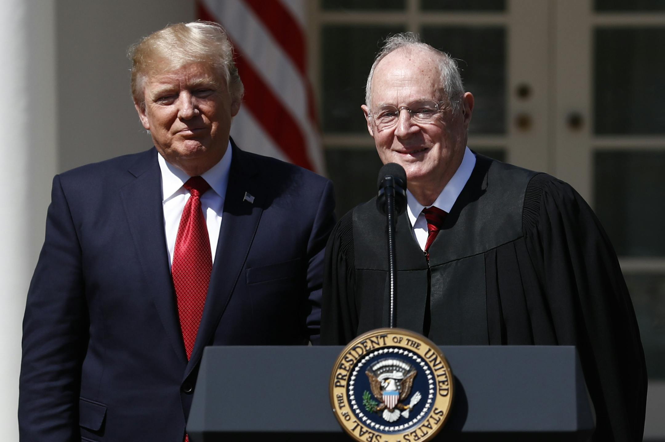 FILE - In this April 10, 2017, file photo, President Donald Trump, left, and Supreme Court Justice Anthony Kennedy participate in a public swearing-in ceremony for Justice Neil Gorsuch in the Rose Garden of the White House White House in Washington. As one justice settles into his new job at the Supreme Court, is another about to leave? Kennedy is so far refusing to comment on speculation that he may soon retire after 29 years on the court. But that hasnít stopped Trump and, obliquely, the