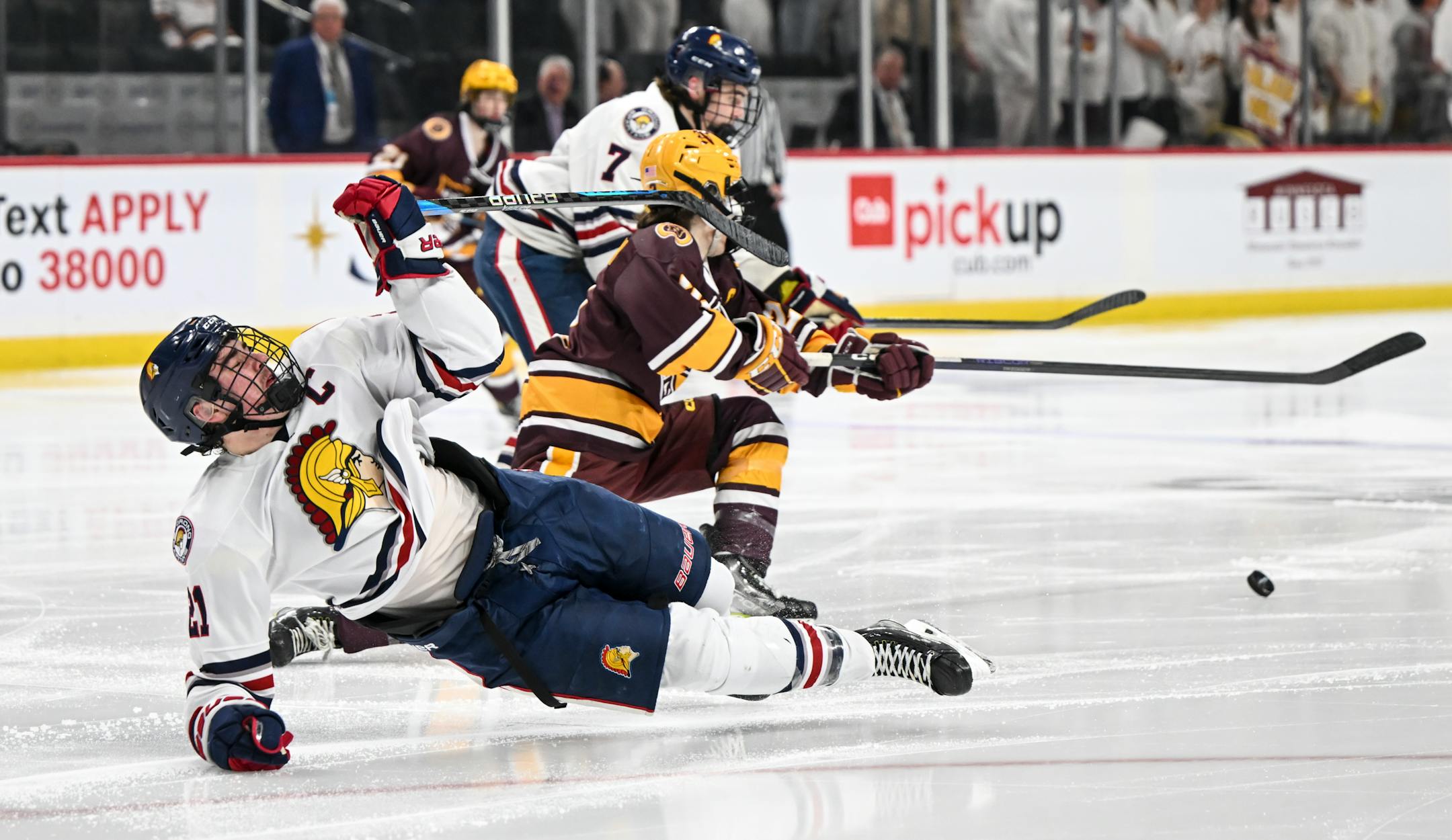Orono forward Bradley Walker (21) is knocked off his skates after colliding with Northfield defenseman Michael Fossum (2) during the second period.