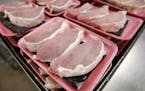 FILE - This March 3, 2011 file photo shows boneless pork loins waiting to be packaged at a local Dahl's grocery store in Des Moines, Iowa. The America