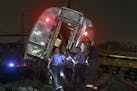 Emergency personnel work the scene of a deadly train wreck, Tuesday, May 12, 2015, in Philadelphia. An Amtrak train headed to New York City derailed a
