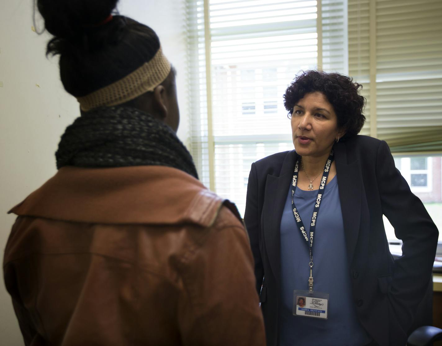 Saida Hentati, Parent Community Coordinator at Montgomery County Public Schools ESOL Bilingual program, spoke French with a new student in her office in Rockville, MD. ] RENEE JONES SCHNEIDER * reneejones@startribune.com