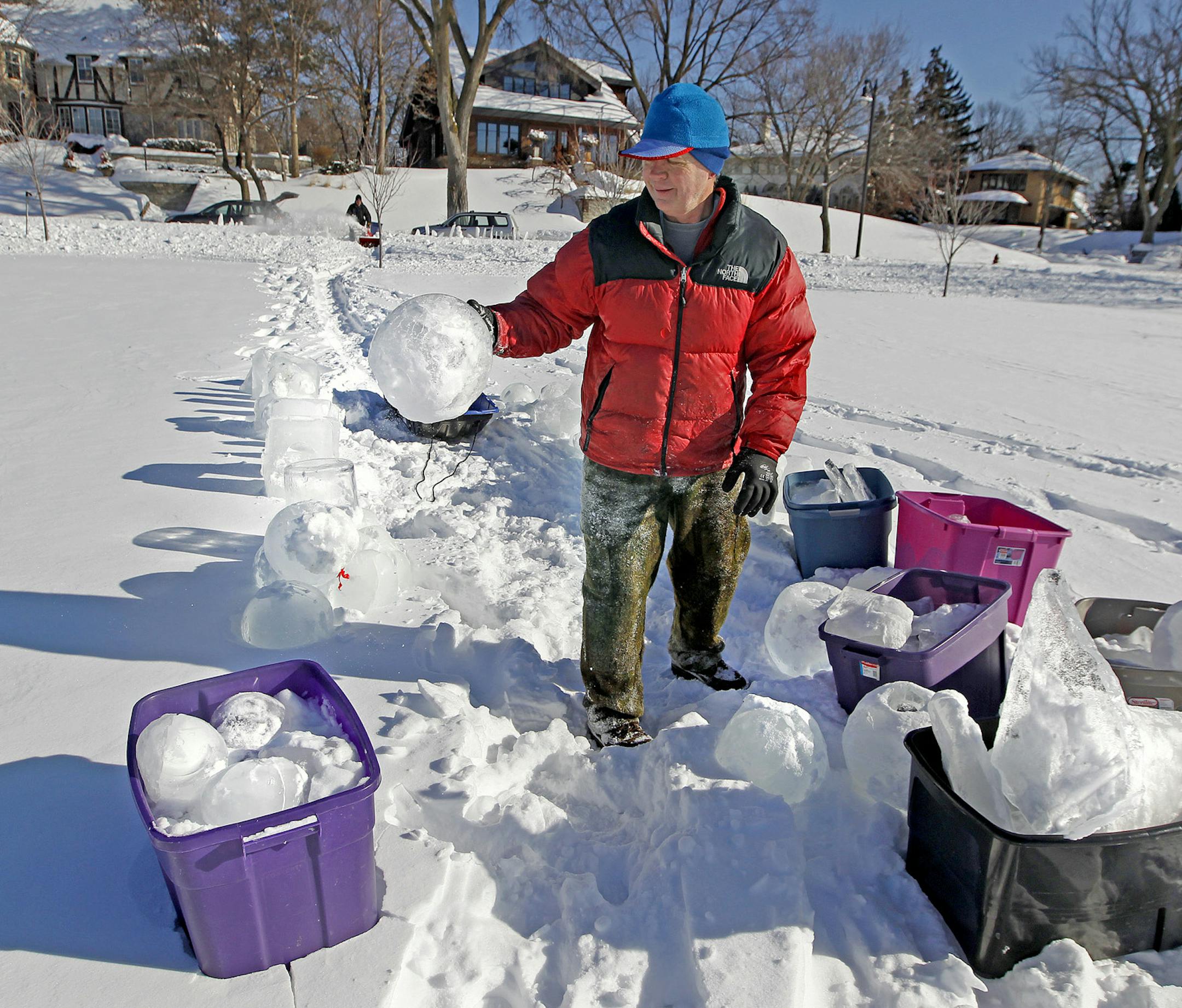 Jeff Evans sorted through ice balls to prepare them for luminaries for the annual City of Lakes Loppet Festival at Lake of the Isles, Friday, January 31, 2014 in Minneapolis, MN. The cross-country skiing event begins Saturday, February 1, 2014. (ELIZABETH FLORES/STAR TRIBUNE) ELIZABETH FLORES • eflores@startribune.com