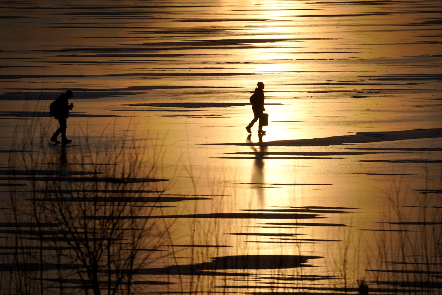 Ice anglers walked across Lake Hiawatha in Minneapolis in search of a good fishing spot in January of 2019.