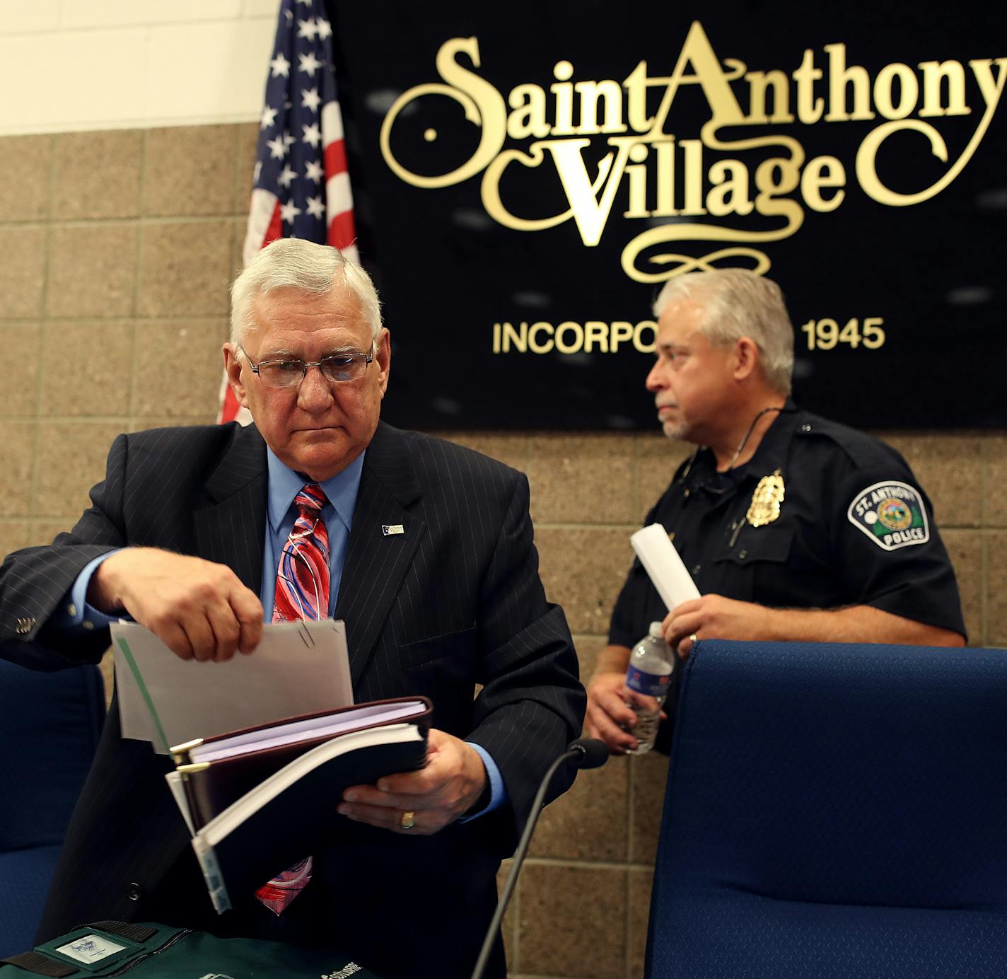 St. Anthony Mayor Jerry Faust left and Police Chief Jon Mangseth packed up after listing to community members speak about racial profiling Tuesday, June 27, 2017 in St. Anthony , MN. ] JERRY HOLT &#xef; jerry.holt@startribune.com