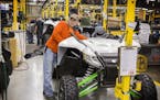 A factory worker assembles the 2016 Wildcat X side-by-side vehicle in the Arctic Cat factory in Thief River Falls on Wednesday, September 30, 2015. ] 