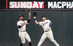 Minnesota Twins center fielder Byron Buxton (25) and right fielder Robbie Grossman (36) collided as they chased down a fly ball, caught by Buxton