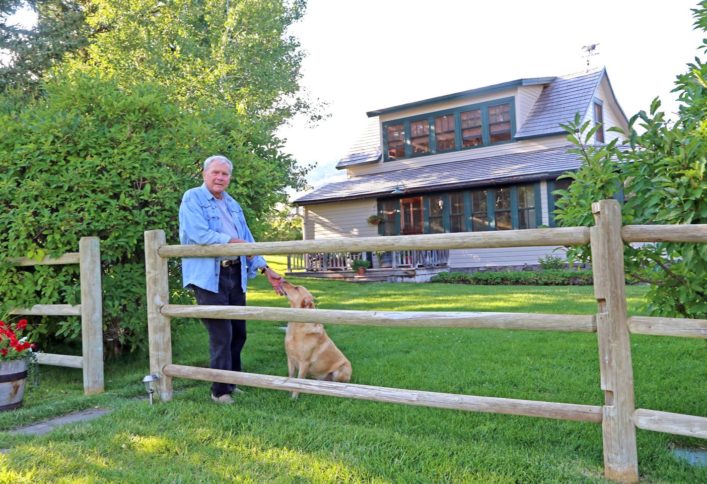 Retired NBC News anchor Tom Brokaw with his Labrador, Red, on Brokaw's Montana ranch. Brokaw, an avid bird hunter and South Dakota native, spends summers and much of the fall with his wife, Meredith, on the 5,000-acre ranch, where in September and October he hunts sharptailed grouse and Hungarian partridge.