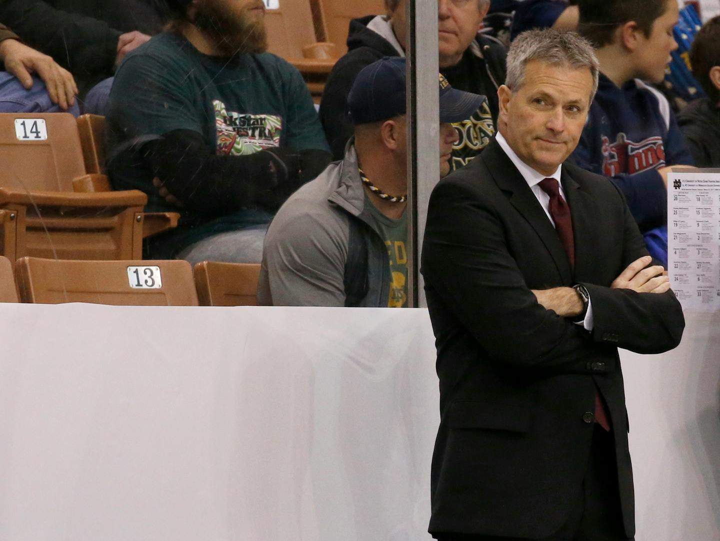 Minnesota head coach Don Lucia looks on from the bench before the start of an NCAA regional men�s college hockey tournament game against Notre Dame, Saturday, March 25, 2017 in Manchester, N.H. (AP Photo/Mary Schwalm)