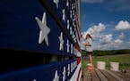 Ann Klindworth painted the names of 15 relatives who have served in the U.S. military on the family barn in their honor for Memorial Day Sunday May 29