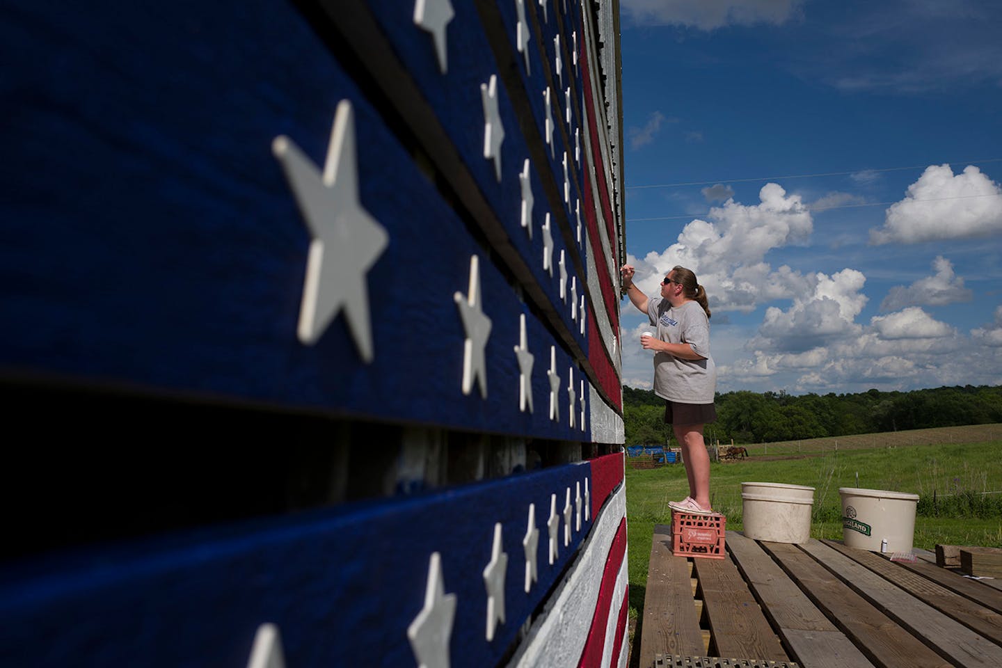 Ann Klindworth painted the names of 15 relatives who have served in the U.S. military on the family barn in their honor for Memorial Day Sunday May 29 2016 in Chatfield, MN.