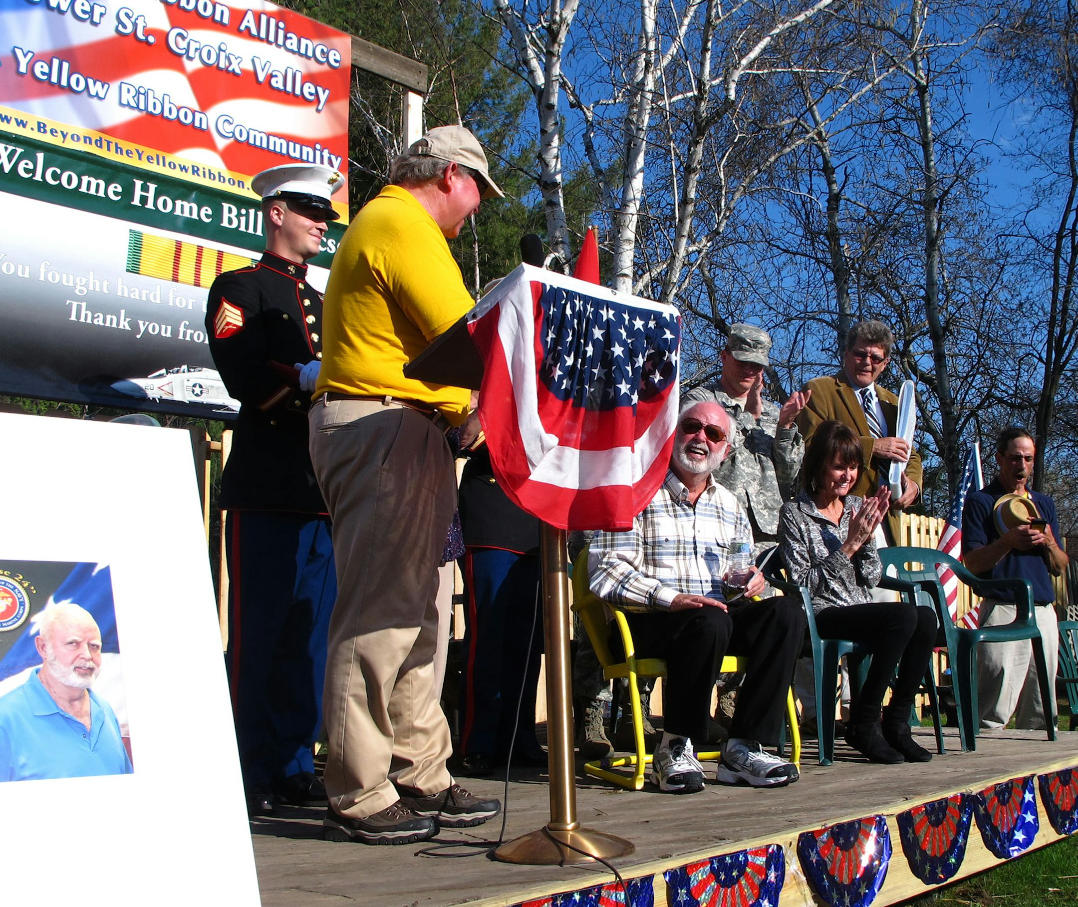 Credit: Photo by Kevin Giles Cutline: William Isaacson, center, was recognized for his service as a Marine Corps pilot in Vietnam during an event in Afton on Tuesday. Isaacson, an Afton resident, never got a homecoming after his return from Vietnam in 1966.
